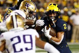 Washington lead trainer Jimmy Lake clarifies how Michigan wore their rescue down