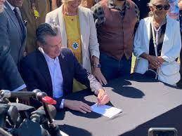 California Gov. Gavin Newsom signs law returning beachfore land took from Dark family
